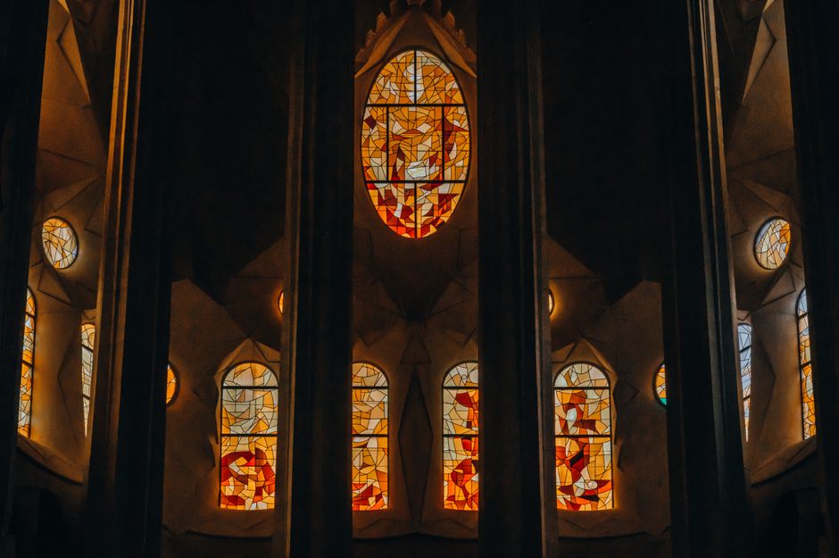 Intricate stained glass windows inside Sagrada Familia, Barcelona.