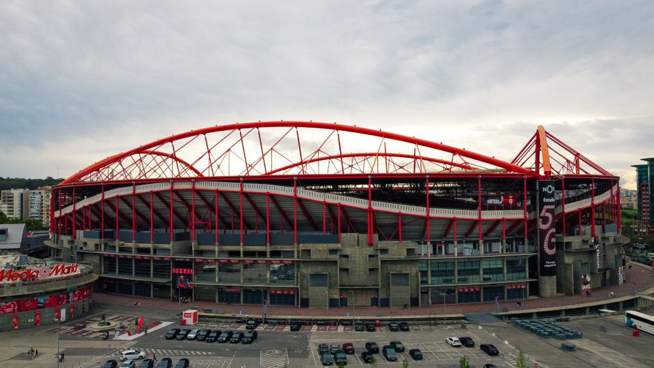 Aerial shot of the iconic Estádio da Luz in Lisbon, known for its striking red arches and modern architecture.