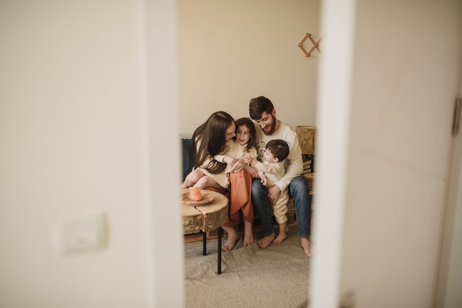 A loving family enjoying a warm, intimate moment together indoors.
