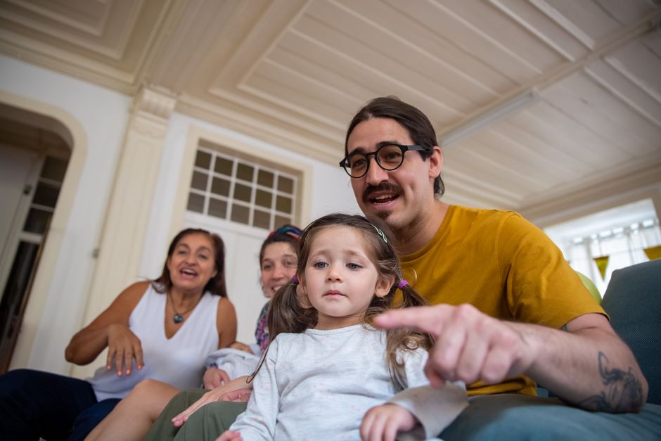 Cheerful family at home in Portugal enjoying quality time together indoors.