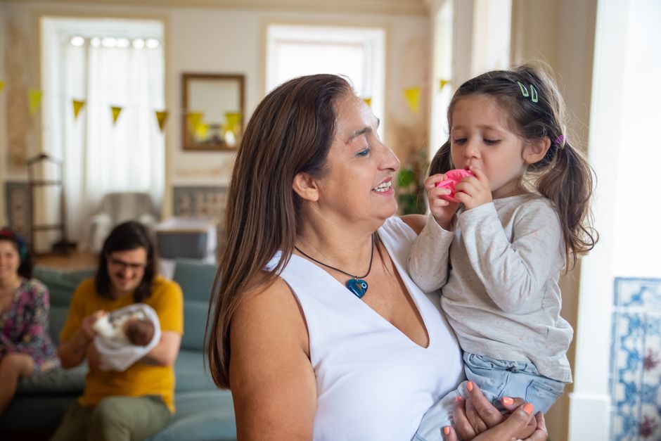 A loving family scene with a mother and child enjoying a cozy indoor moment. Captured in Portugal.