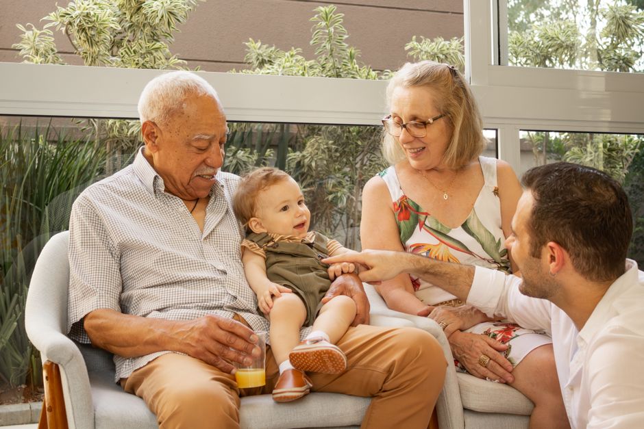 A joyful multigenerational family spending quality time together indoors.